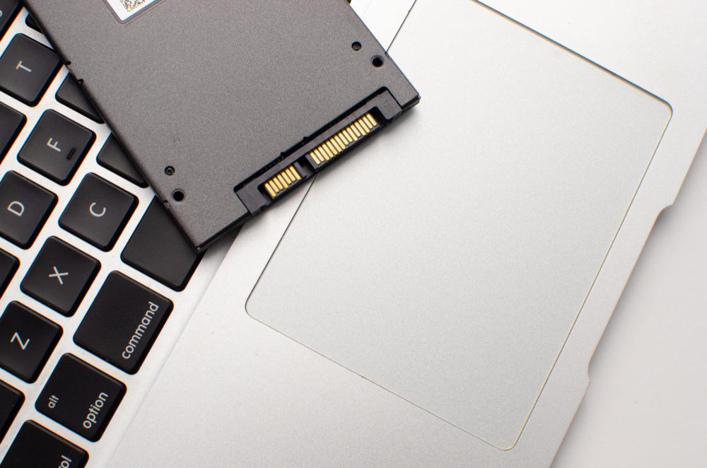 SSD placed on a laptop for storage upgrade planning