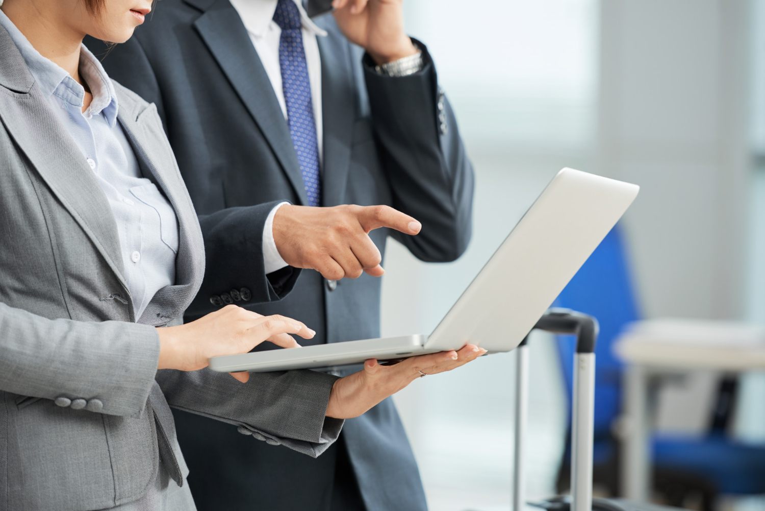 Business users reviewing a laptop for office workflow planning